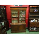 A 1930's Regency style mahogany glazed bookcase,