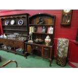 A Queen Anne style hardwood dresser, plate rack above two door, single drawer base,