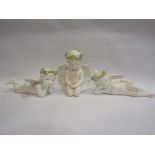 Three decorative ceramic cherubs,
