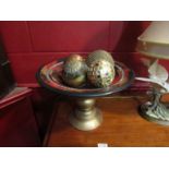 A mosaic bowl on pedestal stand with four decorative ball contents,