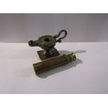 A silver Aladdin lamp table lighter a/f and a small brass telescope
