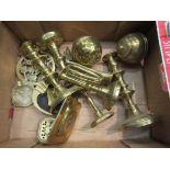 A selection of brass ornaments including candlesticks, tea caddies,