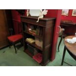 A circa 1900 oak freestanding bookshelf with height adjustable shelves and carved decoration,