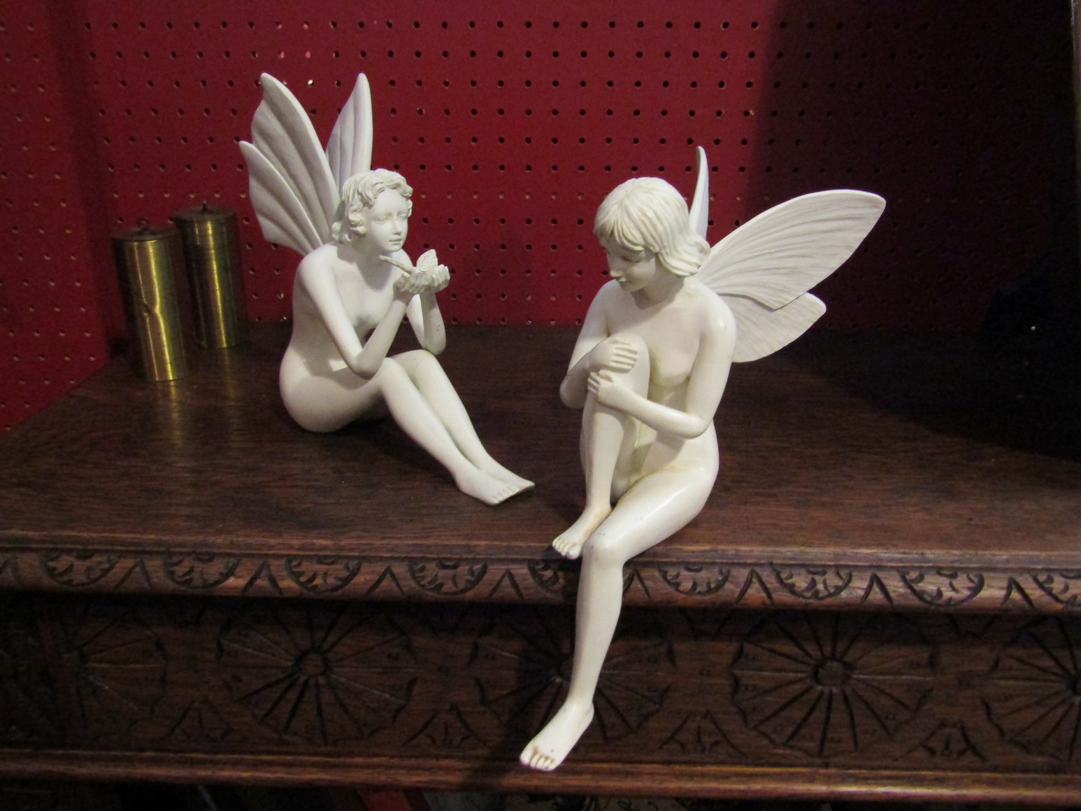 A pair of decorative fairy figures