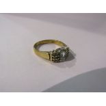 A 9ct gold ring with square aquamarine stone flanked by six small diamonds. Size N, 2.