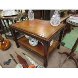 A Bevan and Funnel Georgian style mahogany two tier lamp table with gilt tooled leather shelves,