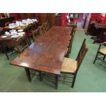 A Continental 9' oak refectory table on square tapering legs,