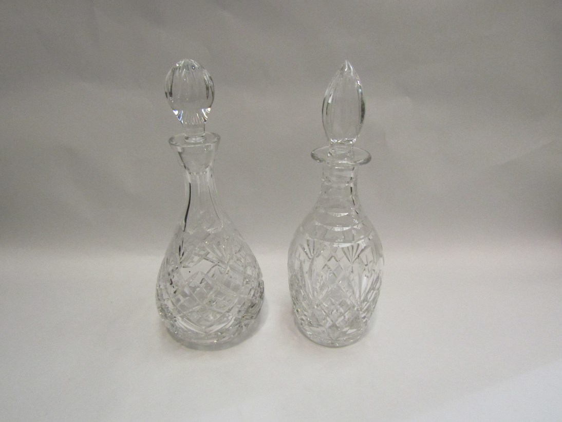Two cut glass decanters with stoppers