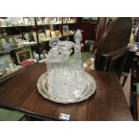 Three crystal decanters on silver plated tray