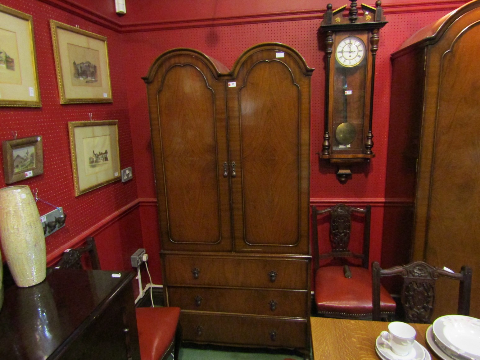 A 20th Century Butilux Queen Anne style two door wardrobe on three drawer base,