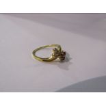 A gold ring with ruby trefoil and diamond trefoil set in a twist, 18ct gold. Size M, 2.