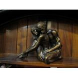 A decorative bronze effect figure of embracing couple, 26.