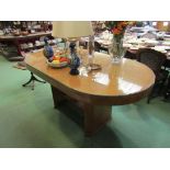 A Deco dining table with oblong wood and glass top,