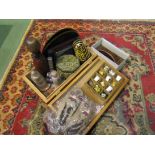 A decorative box and contents containing mostly tourist related items including paperweights,