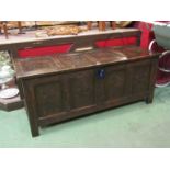 A 17th Century panelled oak coffer (with key) carved floral panels to front. Candle box to interior.