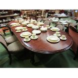 An early Victorian style mahogany extending dining table with two extra leaves over turned and