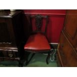 A set of four Victorian dining chairs with pierced splats and leatherette seats