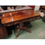 A Victorian flame mahogany tea table converted into a side table, quatreform base,