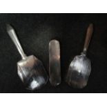 A silver three piece dressing set,