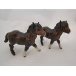 A pair of Beswick Shetland Foals in brown gloss,
