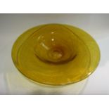 An amber glass shallow dish with string effect design,