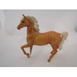 A Beswick Palomino (Prancing Arab type) in gloss, model no.