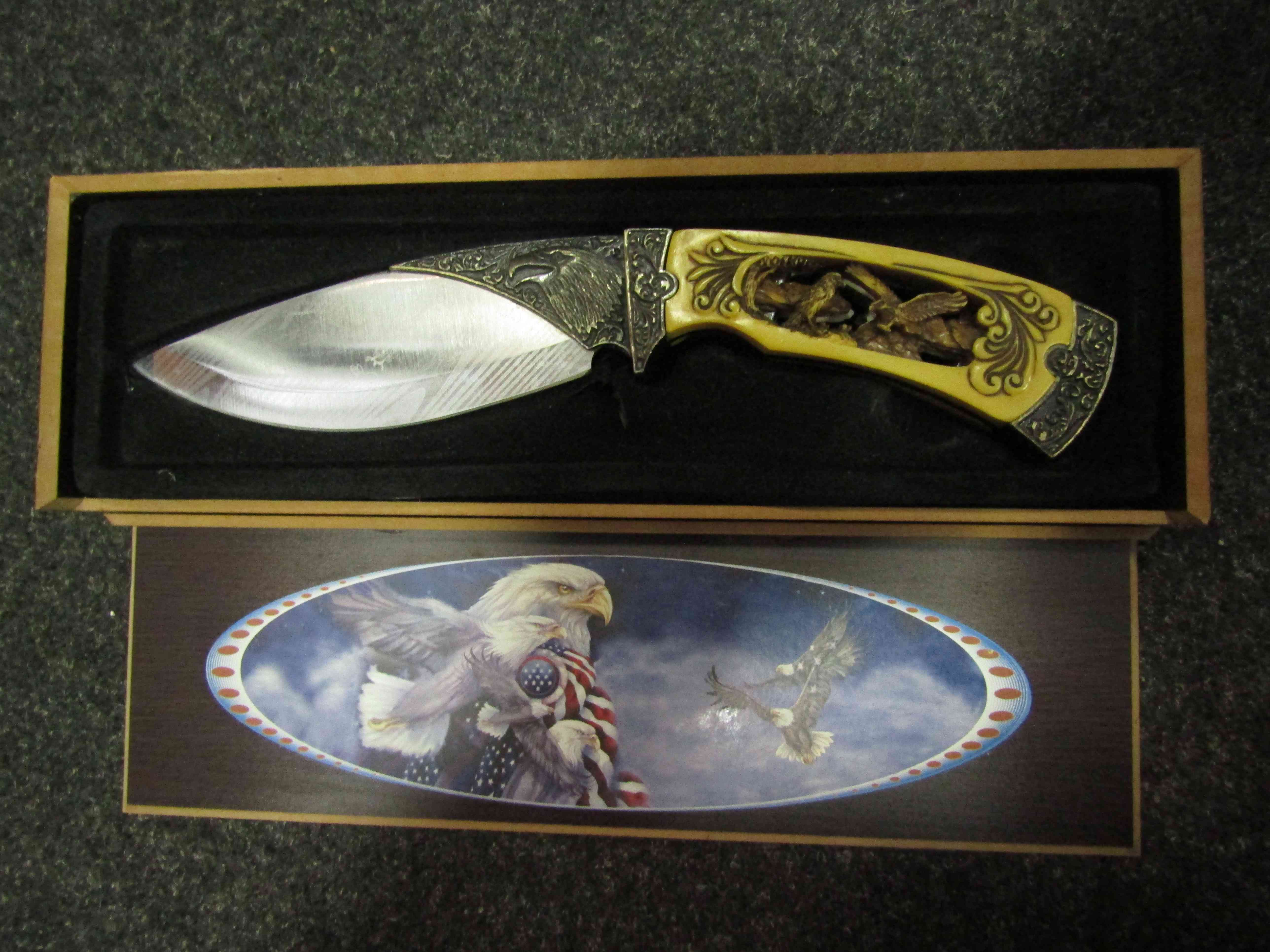 An Eastern style decorative knife, etched with eagles, carved handle,