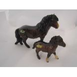 A Beswick Shetland Pony in brown gloss, model no 1033 and a Beswick Shetland Foal in brown gloss,