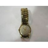 A gentleman's 9ct gold wristwatch with silvered dial, gold plated strap,