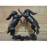 A pair of limited edition solid bronze boxing hares, boxed with certificate 201/350,