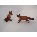 A Beswick Fox seated in gloss, model no. 1748 and a Beswick Fox standing in gloss, model no.