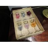 A boxed set of six 1945 coloured sherry glasses