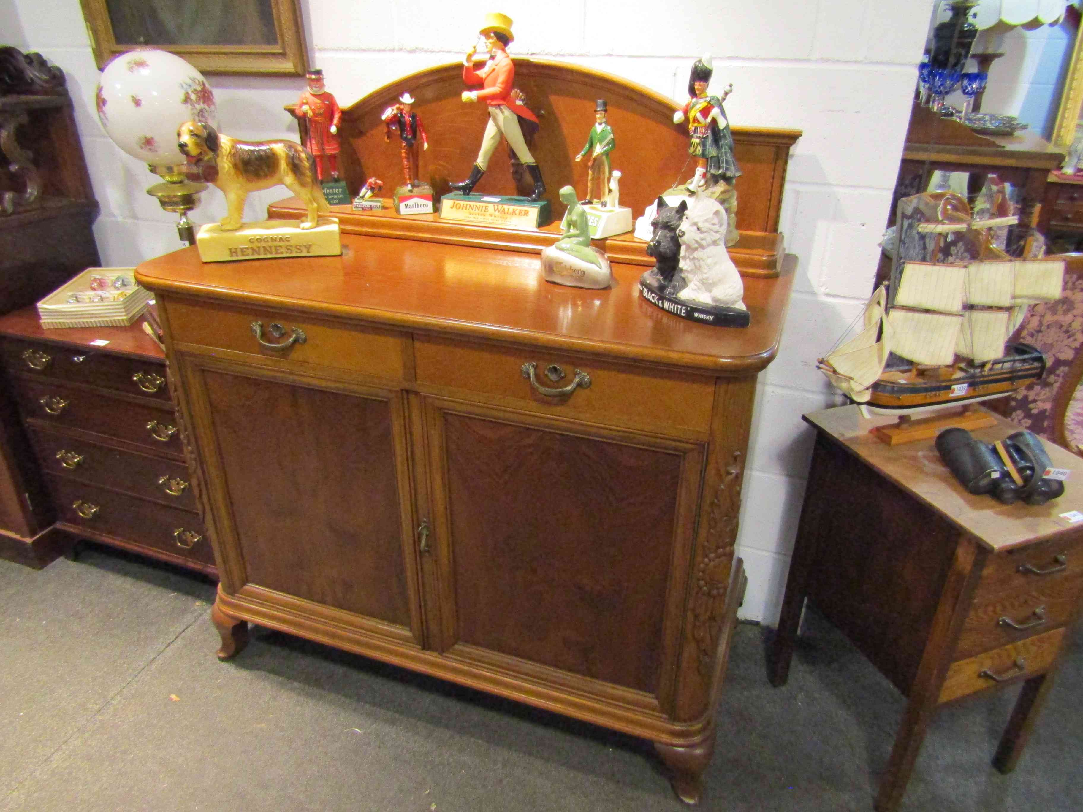 A French oak and walnut dresser base with upstand and key,