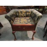 An Edwardian mahogany quarter veneered dressing table stool the single base drawer on pad foot