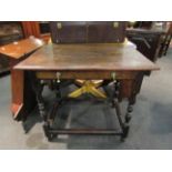 An early 19th Century oak side table, turned supports,