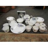 A Victoria china floral print tea set including teapot, milk jug, sugar bowl, cups,