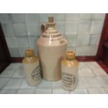 A stoneware flagon with cork stopper "Youngs Crawshay & Youngs Wine & Spirit Merchants Diss" plus