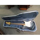 An Encore electric guitar with hard case