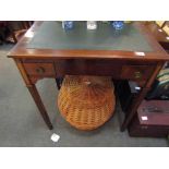 A French fruit wood 19th Century writing desk of two drawers on square tapering brass cap footed