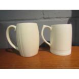 Two white glazed ceramic mugs designed by Keith Murray for Wedgwood,
