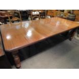 A Circa 1900 mahogany extending dining table with two extra leaves and winding handle,