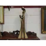 A large resin bronze figure of mother and child, repairs to base,