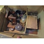 A box containing miniature assorted items including blue glass liners, trophy stands,