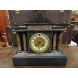 A Victorian black slate mantel clock of architectural form,