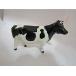 A Beswick Friesian Cow CH. "Claybury Legwater" in gloss, model no.