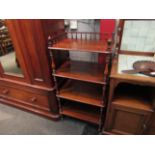 Circa 1860 a walnut four tier whatnot the three quarter turned spindle gallery and finials raised