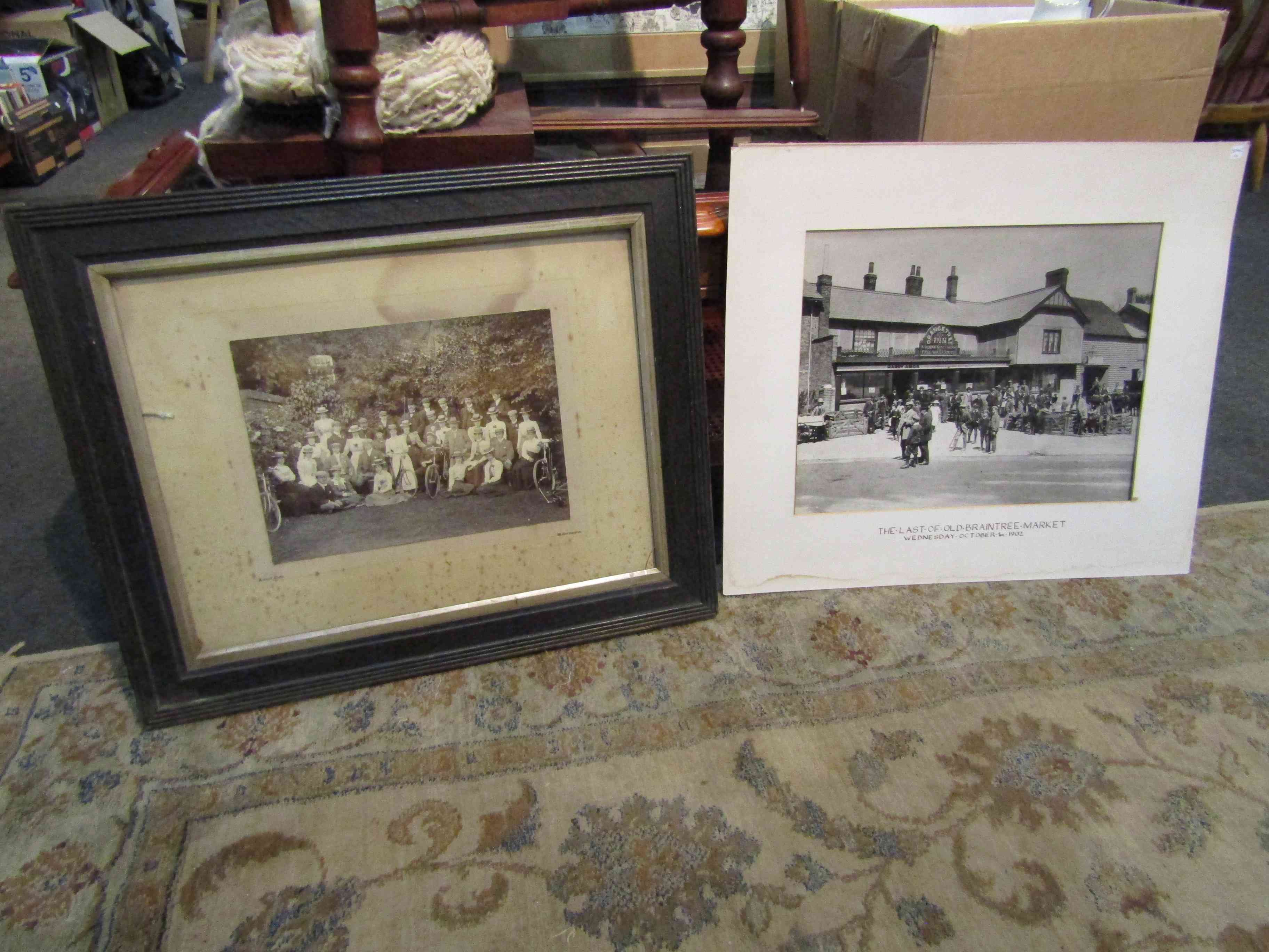 Two vintage group photographs, one depicting couple in period costume with bicycles,
