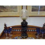 A Bristol blue glass oil lamp with bird decoration