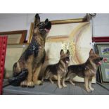 Three ceramic Alsatian dogs,