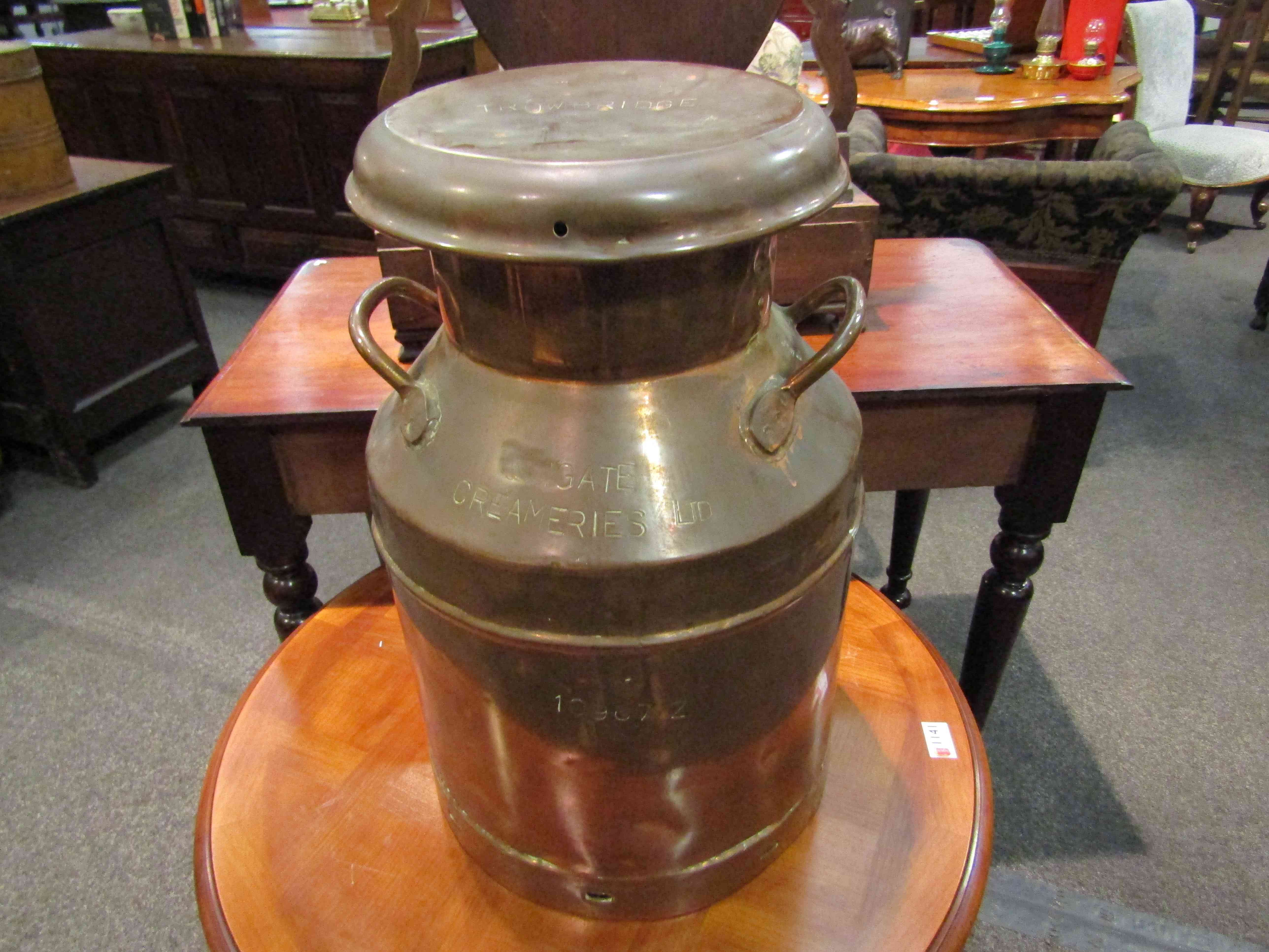 A copper 5 gallon twin handle Trowbridge Creameries lidded milk churn